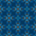 Background, blue, seamless pattern with blue flowers and orange branches. Royalty Free Stock Photo