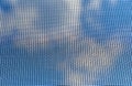 Background of blue sky through fine mosquito net Royalty Free Stock Photo