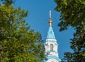 View of the belfry of the Cathedral from behind the trees.. Royalty Free Stock Photo