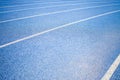 Background of blue track for running at stadium Royalty Free Stock Photo