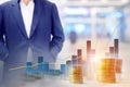 Background blur of a businessman standing with walkway Inside the building and graphs, statistics Indicates the positive direction Royalty Free Stock Photo