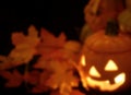 Background blur Halloween still life with ceramic jack-o-lantern