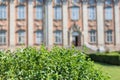 Background of blur House of Nobility Riddarhuset in Stockholm old town. In the foreground green bushes Royalty Free Stock Photo