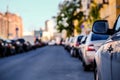 Background, blur, out of focus, bokeh. Morning soft sunlight, cars parked on the streets of the city