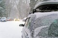 Background, blur, out of focus, sideways. A car during a snowstorm on the road with its headlights on. Winter, snow Royalty Free Stock Photo