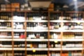 Background blur of wine shelf rack at retail store Royalty Free Stock Photo