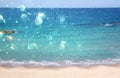 Background of blurred beach and sea waves with bokeh lights Royalty Free Stock Photo