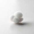 The background is blurred emphasizing the cotton balls as the main focus Royalty Free Stock Photo