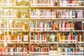 The background blurred Image many books on bookshelf in library and orange leak light Royalty Free Stock Photo