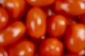 Background of blurred red of cherry tomato. Top view. Blur fresh cherry tomatoes. Tomato background. Royalty Free Stock Photo