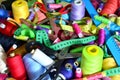 Background of bobbins with multicolored threads for sewing. Needlework, sewing and tailoring concept. Royalty Free Stock Photo