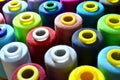 Background of bobbins with multicolored threads for sewing. Royalty Free Stock Photo