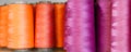 Background - bobbins of blue and purple threads