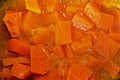 background of boiled orange pumpkin cut into pieces Royalty Free Stock Photo