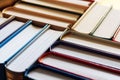 Background of books arranged in stacks in bookstore, selective focus