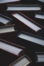 Background of books in hardcovers, full-frame texture, vertical shot Royalty Free Stock Photo