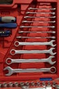 Background of a box with an open tool. A set of working tools lies in a red drawer. The tools are arranged in order in Royalty Free Stock Photo