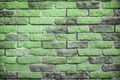 Background of the brick wall is green. Wasting away the background of vintage brick walls. Texture of worn and dirty brickwork