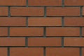 The background of a brick wall, made of red, ceramic bricks. Royalty Free Stock Photo