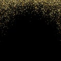 Background of bright glowing gold dust on black. Abstract background gold glitters