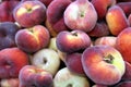 Background of bright, ripe, fig peaches in a pile.