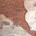 Background broken wall with dirty plaster and old brick.