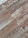 A background of brown, aged narrow boards, arranged diagonally Royalty Free Stock Photo