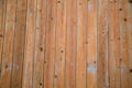 Background of brown boards with knots hammered nails
