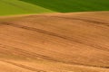 Background of brown earth. View of freshly plowed field before seeding. Royalty Free Stock Photo