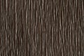 Background of brown pressed corrugated paper with vertical texture taken close up