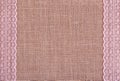 Background of burlap with pink laces