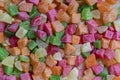 Background candied colorful fruit. Dried pineapple bits. Colored dried tropical fruit. Close up