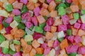 Background candied colorful fruit. Dried pineapple bits. Colored dried tropical fruit. Close up