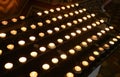 candles lit inside the place of worship by the faithful during the religious celebration Royalty Free Stock Photo