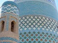 Background of the ceramic colored large minaret Kalta Minor of Khiva in Uzbekistan.