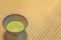 Ceramic Chawan Cup of Japanese Matcha green tea on a tatami mat. Royalty Free Stock Photo