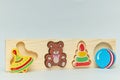 Background of children`s colorful wooden toy figures for children on a light background. vertical view close-up Royalty Free Stock Photo