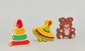 Background of children`s colorful wooden toy figures for children on a light background. vertical view close-up Royalty Free Stock Photo