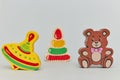 Background of children`s colorful wooden toy figures for children on a light background. vertical view close-up. Royalty Free Stock Photo