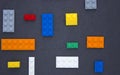 Background for children`s site, for the menu. Children`s constructors on black. Multi-colored cubes. Games for motor developing me Royalty Free Stock Photo