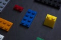 Background for children`s site, for the menu. Children`s constructors on black. Multi-colored cubes. Games for motor developing Royalty Free Stock Photo