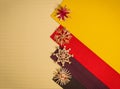 Background for Christmas greeting card- holiday straw decoration, red and yellow color textured paper Royalty Free Stock Photo