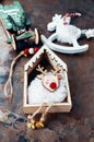 Background of Christmas toys, top view. Sleigh and moose rocking chair with red shiny balls