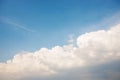 Background of the clear blue cerulean sky with big fluffy white cloud upon on it Royalty Free Stock Photo