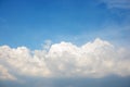 Background of the clear blue cerulean sky with big fluffy white cloud upon on it Royalty Free Stock Photo