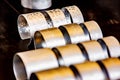 Background, close-up image of a row of sheet metal bracelets handcrafted on site, photo taken at a trade fair in Treviso.