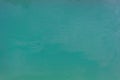 Background close-up, turquoise green water surface lake, outdoors. Royalty Free Stock Photo