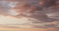 Background of clouds on evening sky with bird and landing plane Royalty Free Stock Photo