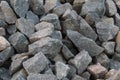 A background of cobblestone stones close-up. stones for the construction of the foundation. Crisis construction of expensive