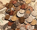 Background of coins lying on paper banknotes of United States. Royalty Free Stock Photo